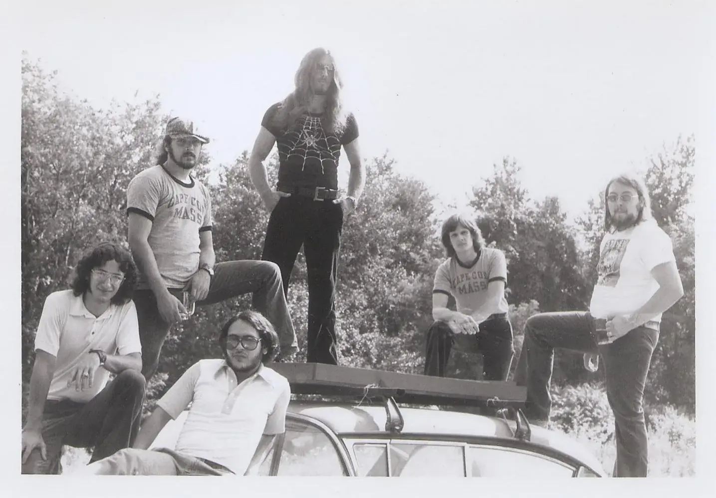 The horn band, by a car